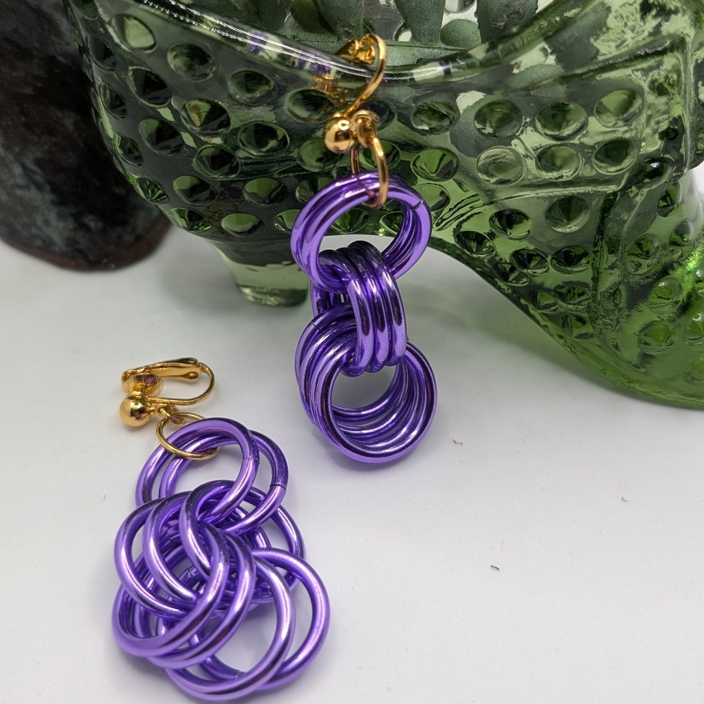 Avon purple rings clip on dangle earrings